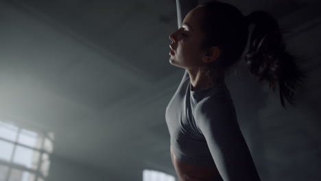 woman doing side bends during training. athlete warming body before workout