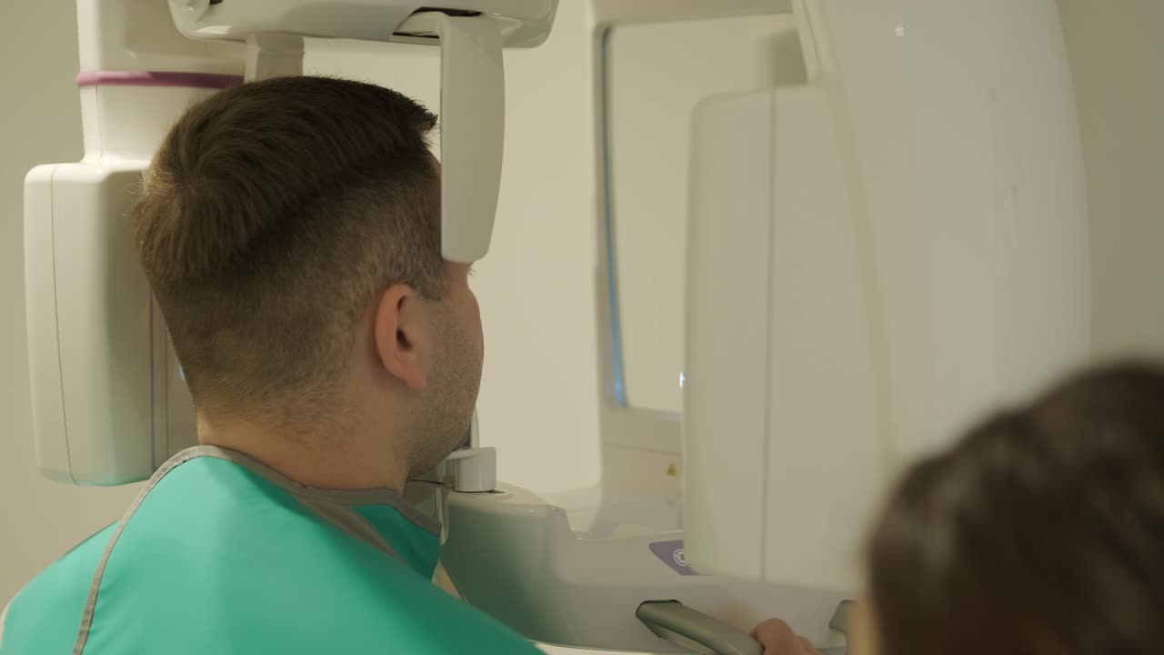 Patient Undergoing Dental X-Ray with Technician