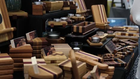 Handcrafted-woodwork-on-display-at-local-market-fair-during-warm-summer-day