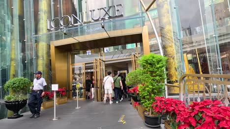 luxury shopping mall entrance with security checks