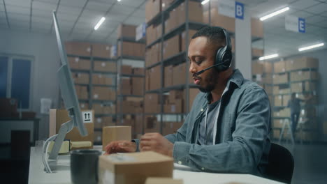 warehouse worker at computer