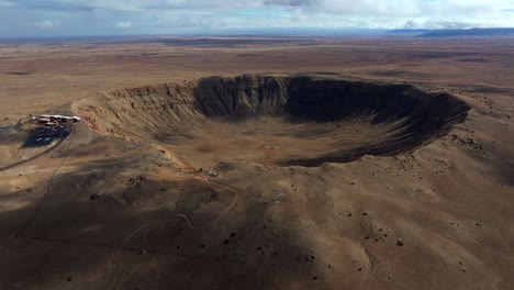 4k aerial of meteor crater or barringer crater in arizona, usa