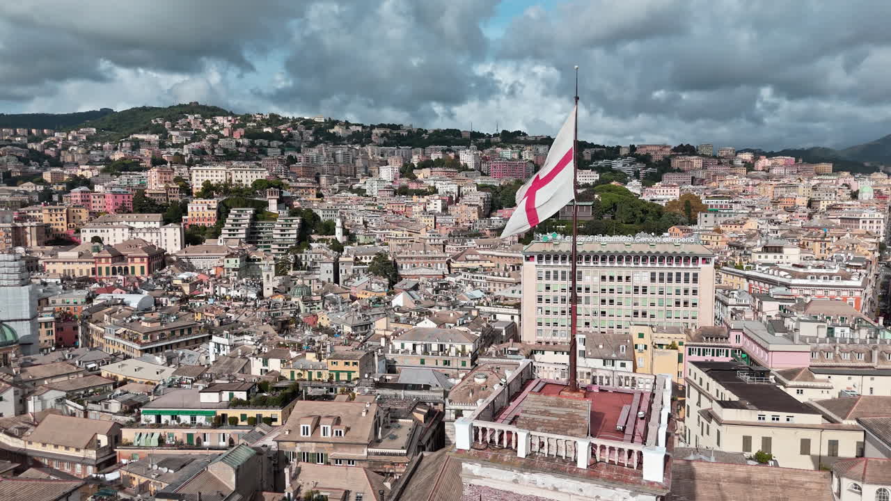 Telephoto slomo aerial view of waving St. George's Cross Flag atop Grimaldina