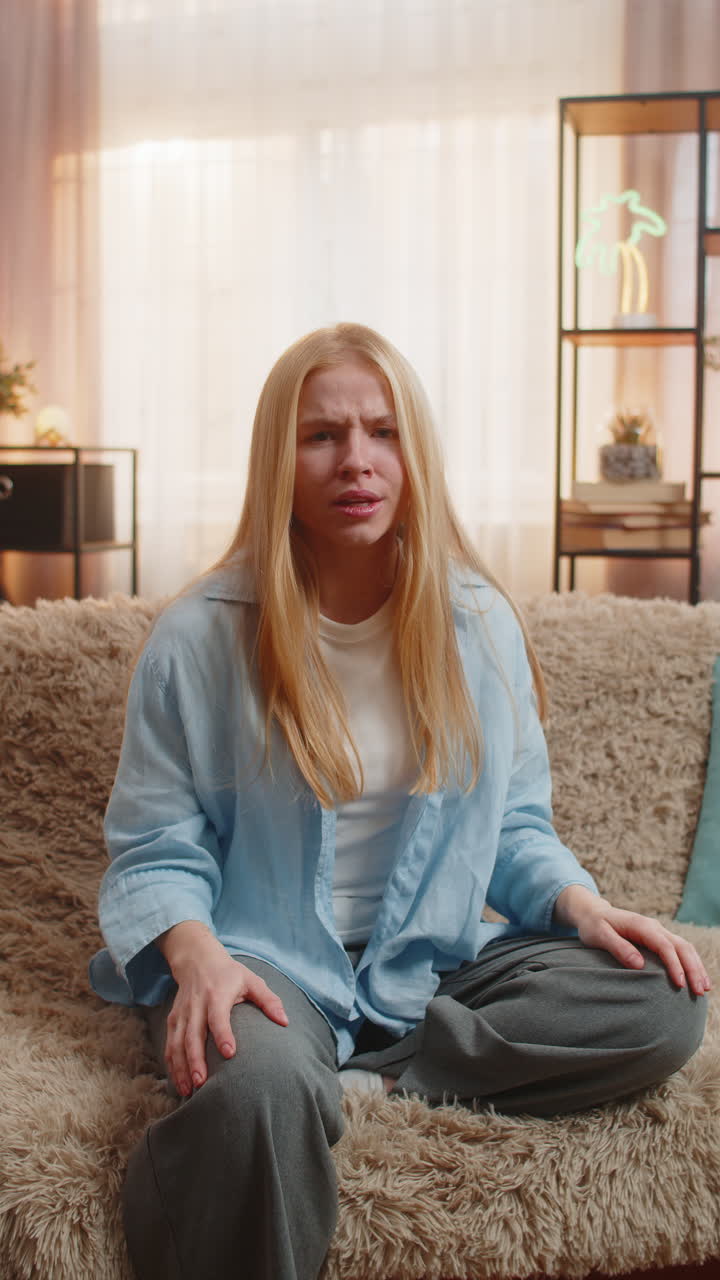 Upset frustrated annoyed woman angry gesture at home big frustration tension strong emotional flare