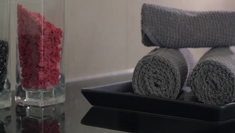 close up view of woman hand putting on plate rolls of towels