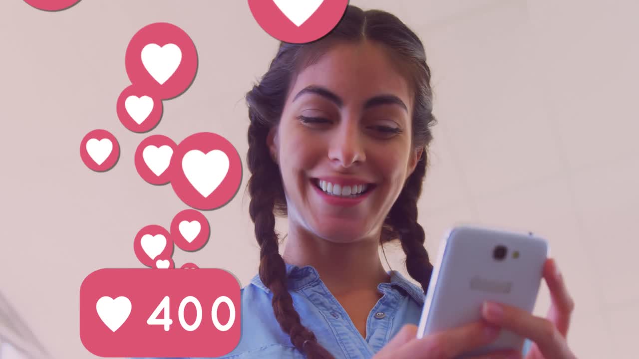 múltiples iconos de corazón con números crecientes flotando contra caucásicos que usan teléfonos inteligentes