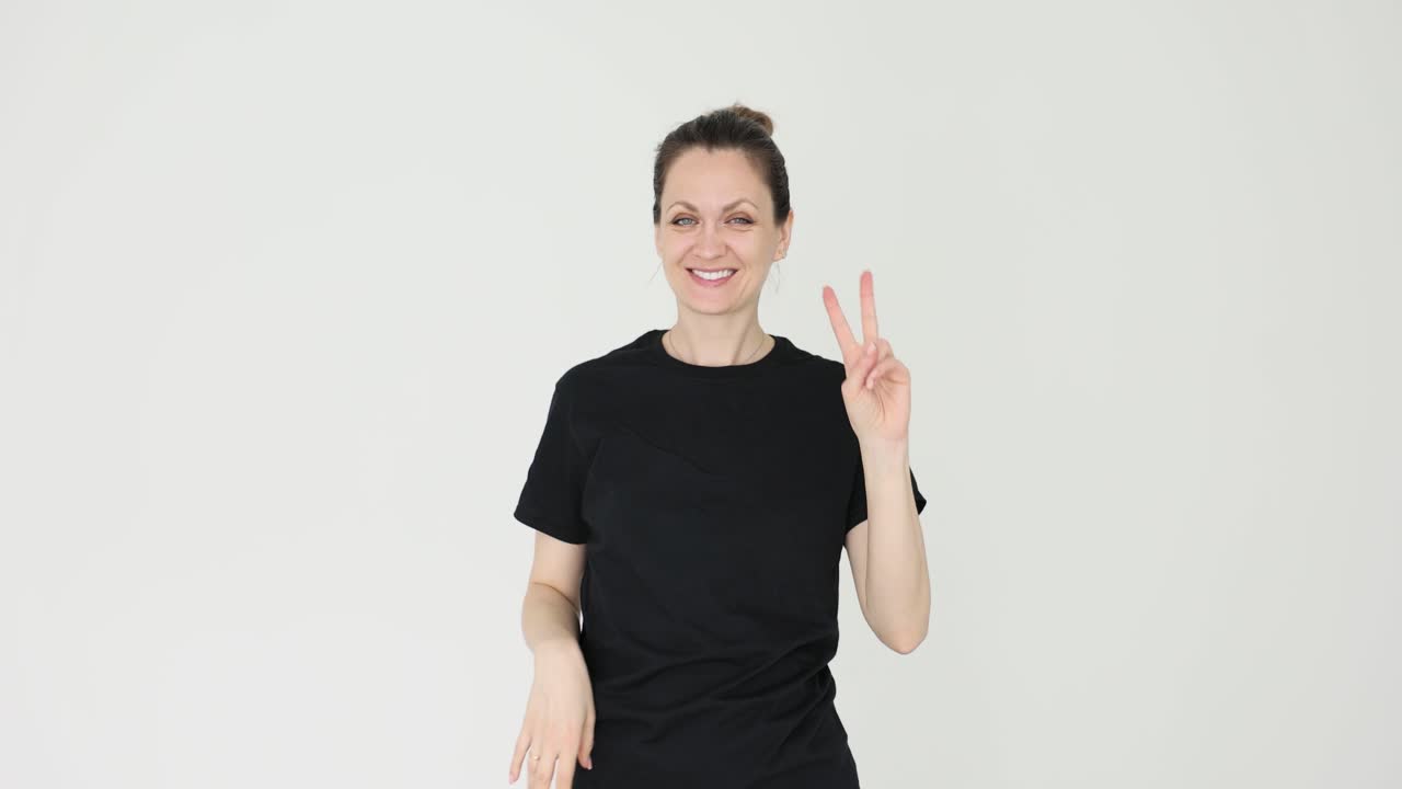 Woman giving peace sign