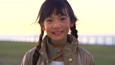 Asian,-little-girl-and-face-at-beach-for-travel