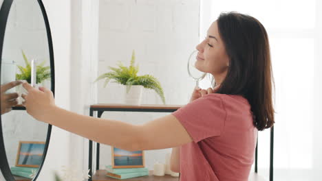 woman taking selfie in front of mirror