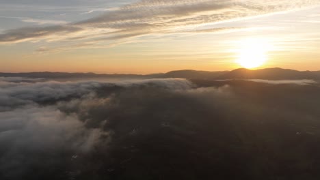 breathtaking timelapse of sunset above fog river flowing