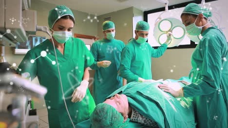 animación de moléculas sobre mujeres y hombres cirujanos caucásicos durante la operación