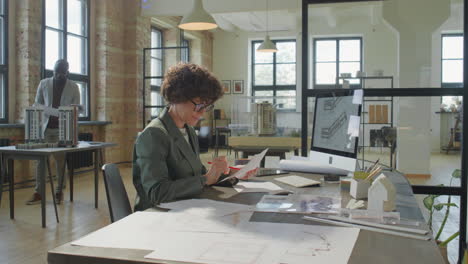 architects working on building designs in a modern office