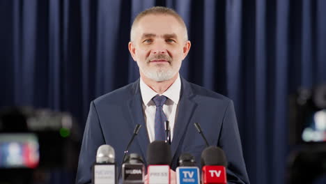portrait of successful political leader at press conference