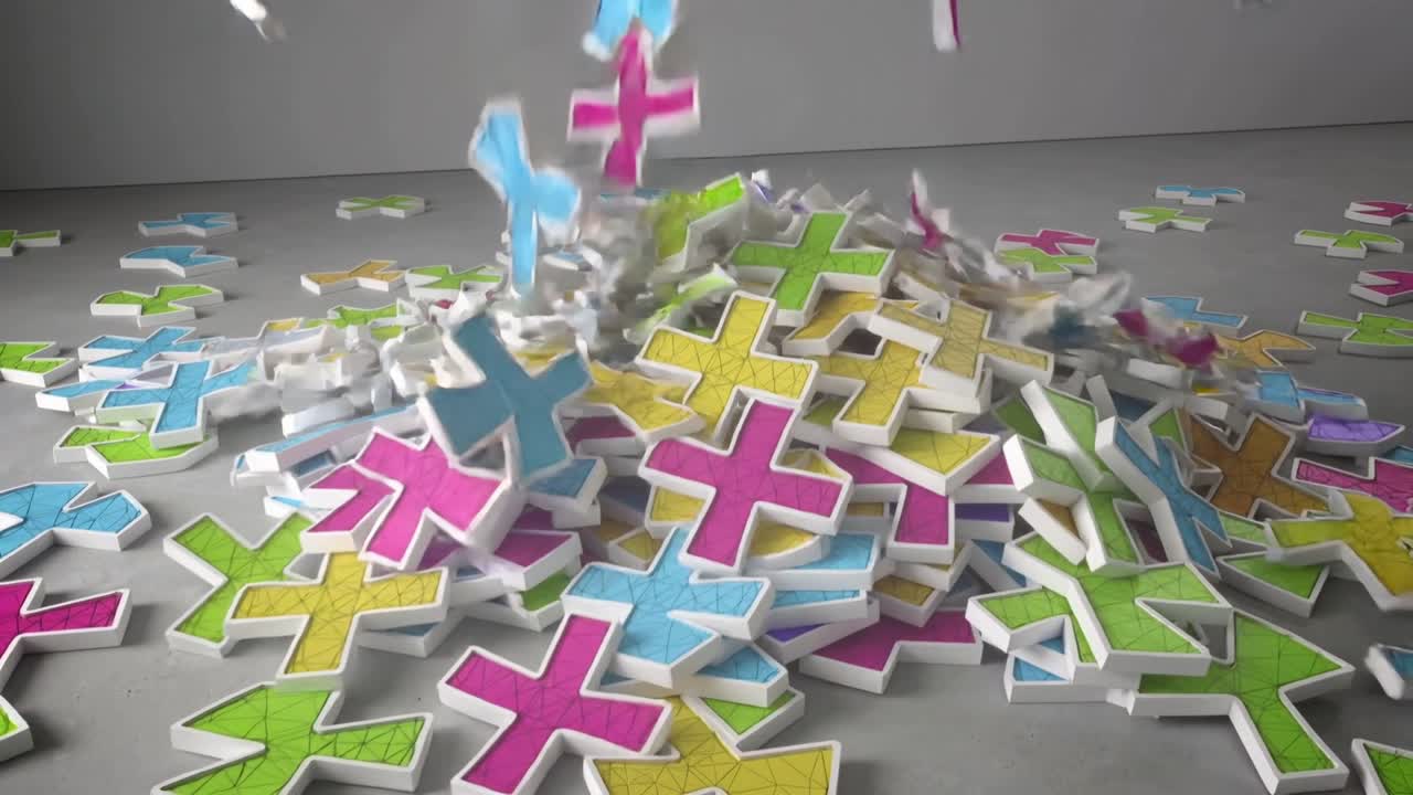 Falling off-frame white-edged plus-shaped pieces striking central pile on grey floor, forming heap