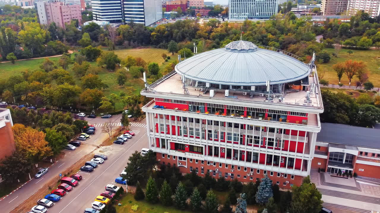 Aerial drone view of university campus among greenery and dwelling houses. Bucharest, Romania