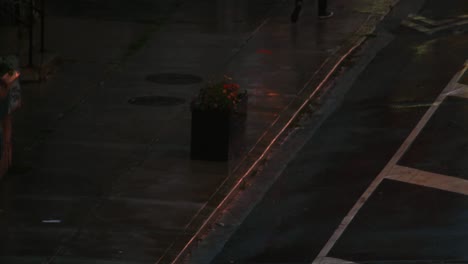establishing shot of foot traffic during a storm.