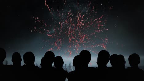 Animation-of-silhouettes-of-people-and-cityscape-over-fireworks