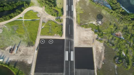 Runway-07-at-gran-roque-in-los-roques-archipelago,-clear-sunny-day,-no-airplanes,-tropical-vibe,-aerial-view