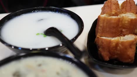 congee and fried dough sticks on a table