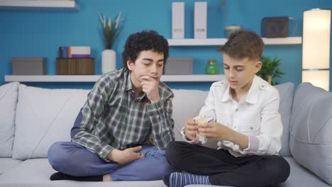 brothers trying to solve the jigsaw puzzle together.