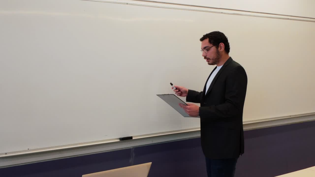 University Professor Reviewing Lecture Notes