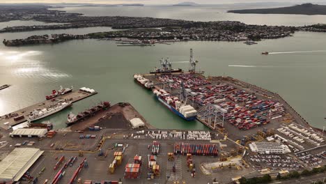 approaching port area with cargo shipping containers, auckland city, new zealand