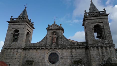 bell towers and saint sculpture in santo estevo monastery, luintra, spain