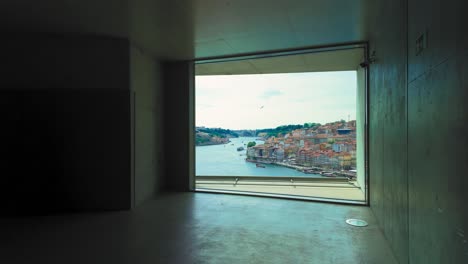window with view of douro river in porto, portugal