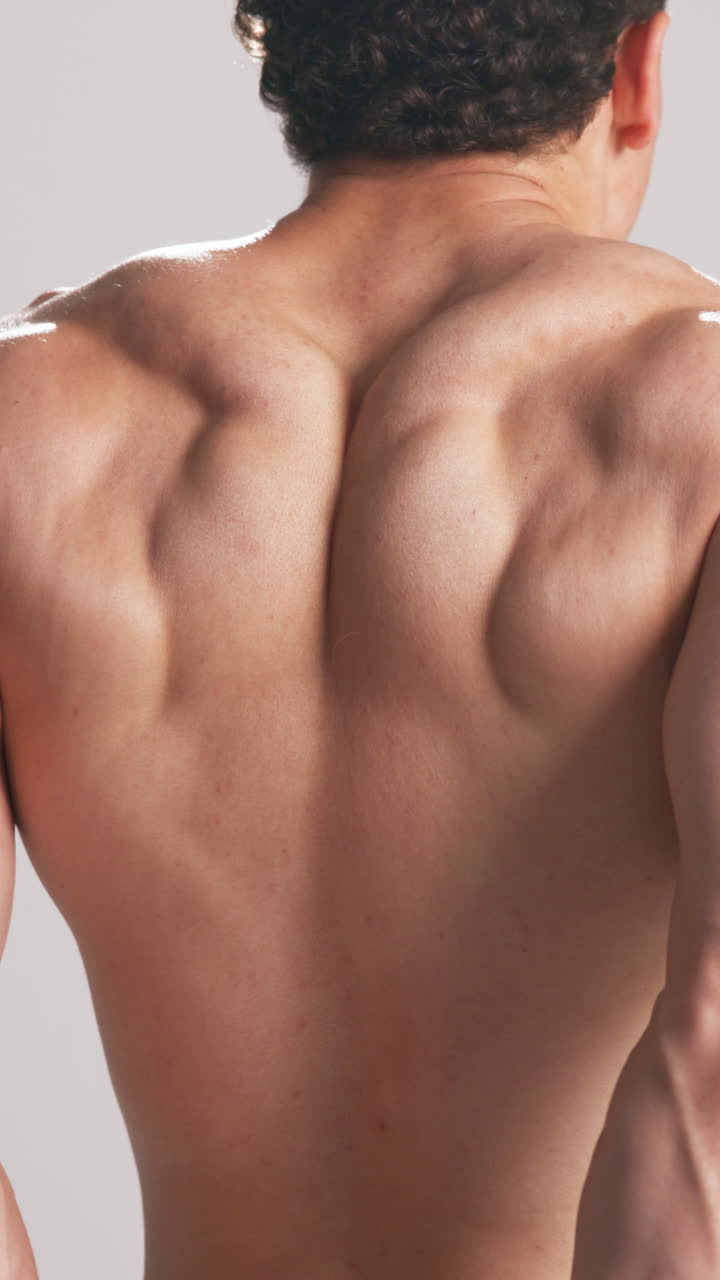 Close-up of Muscular Man's Back Flexing
