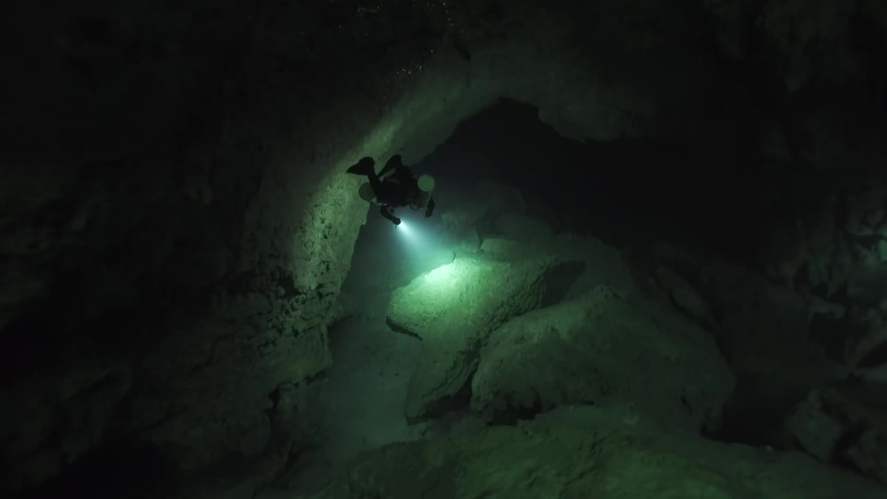 A haunting underwater experience of exploring Angelita Cenote caves in Tulum, México