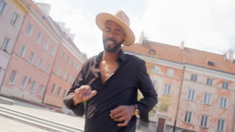 afro caribbean man dancing alone in a public square 4