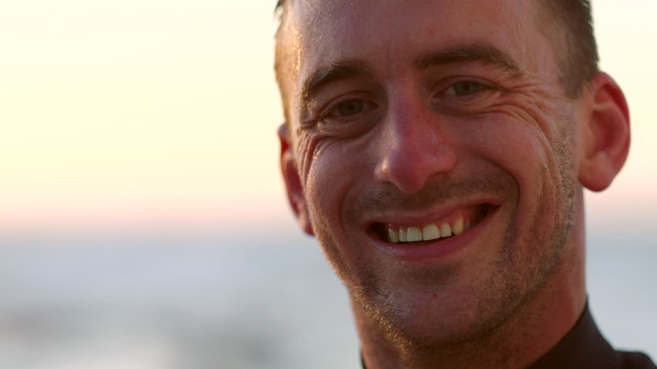 Face of a happy surfer tired