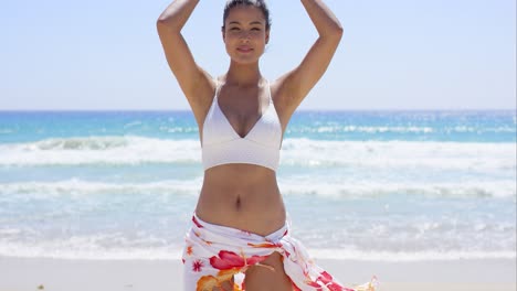 Pretty-woman-wearing-wrap-skirt-and-white-bikini