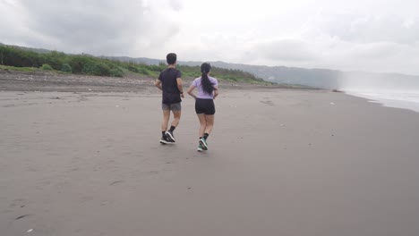 couple running on a beach