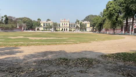 Profile view of Patna University during daytime with a grass field in front in Bihar, India.