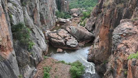 bourke's luck potholes and pooling waters in the canyon