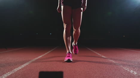 Close-up-legs-of-the-athlete-approach-the-treadmill-and-become-in-position-to-start-the-race