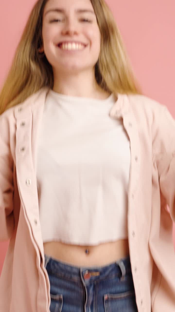 Young woman expressing different emotions while using smartphone