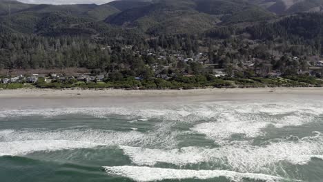 Rockaway-beach-in-county-Tillamook,-Oregon.-Aerial-sideways