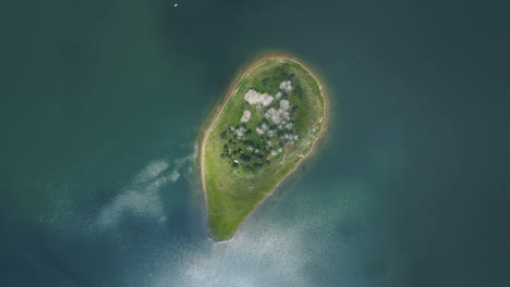 top view of small isolated lake island in batak, bulgaria