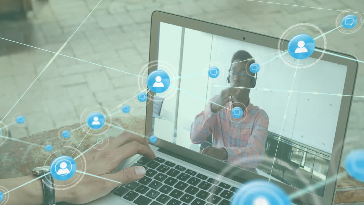 Animation of network of digital icons over mid section of man having video call on laptop at a cafe
