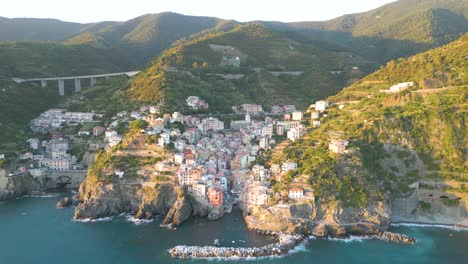 cinematic establishing shot of cinque terre, italy at sunset