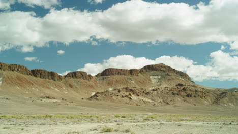 Timelapse-in-the-Nevada-Desert,-clouds-and-dust-trails-through-the-Southwest