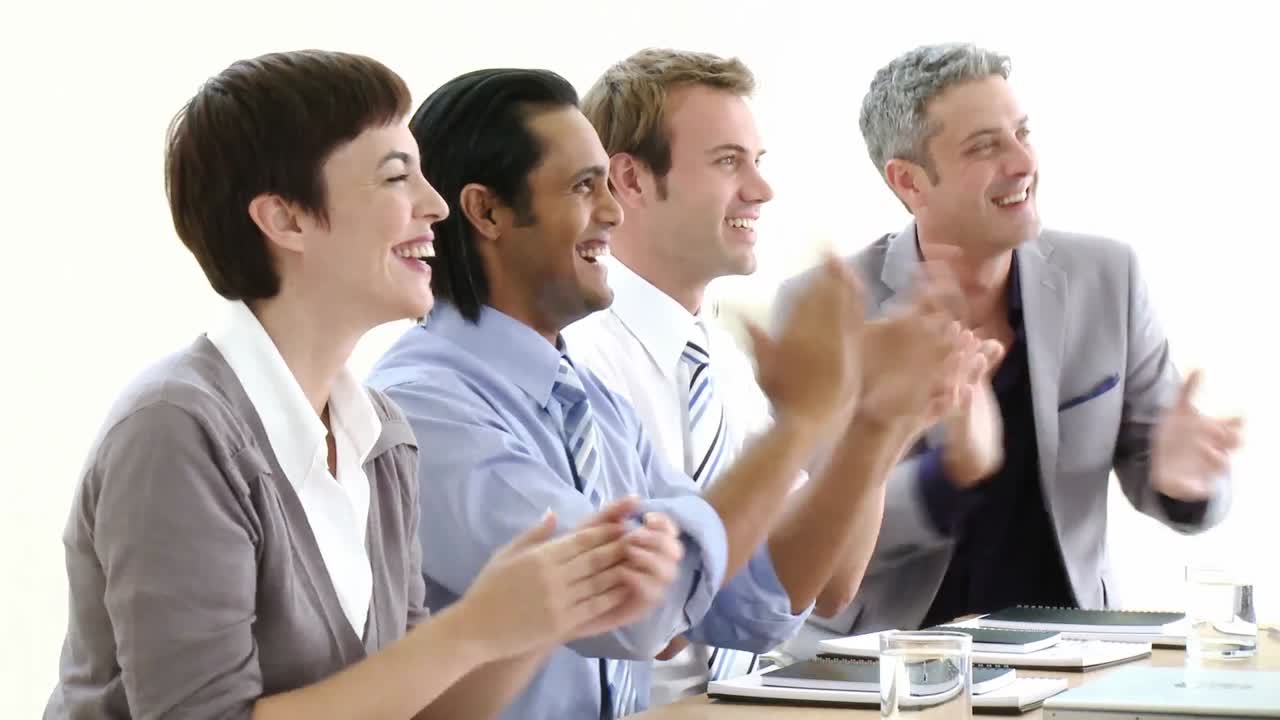 Business people appplauding after a presentation