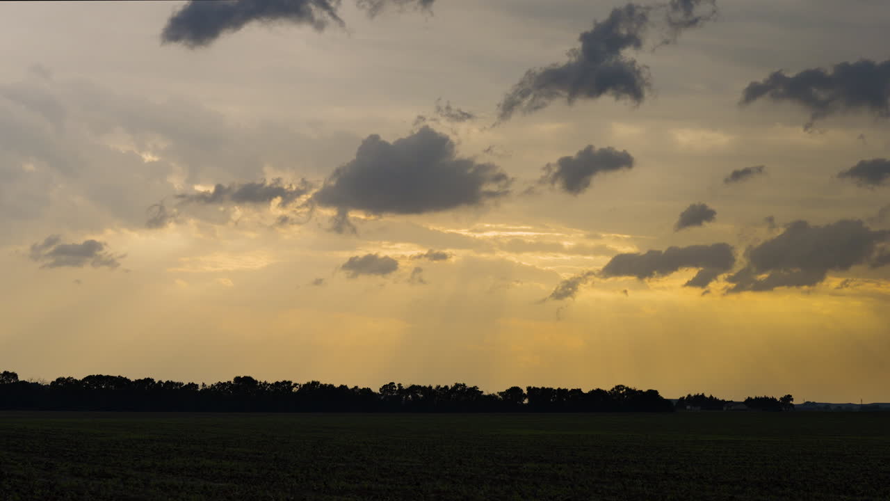 Stunning colorful beams of light shine through a stormy sky