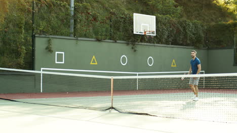 rear view of a teen boy playing tennis with his dad and winning the match