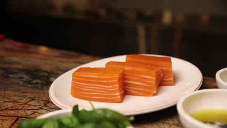 Chef Preparing Sliced Salmon