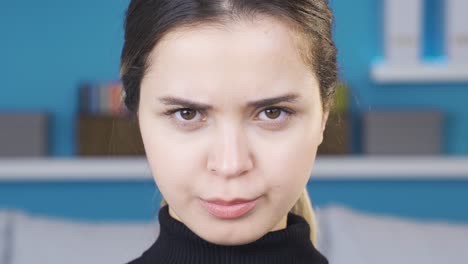 Close-up-of-angry-and-frowning-young-woman.