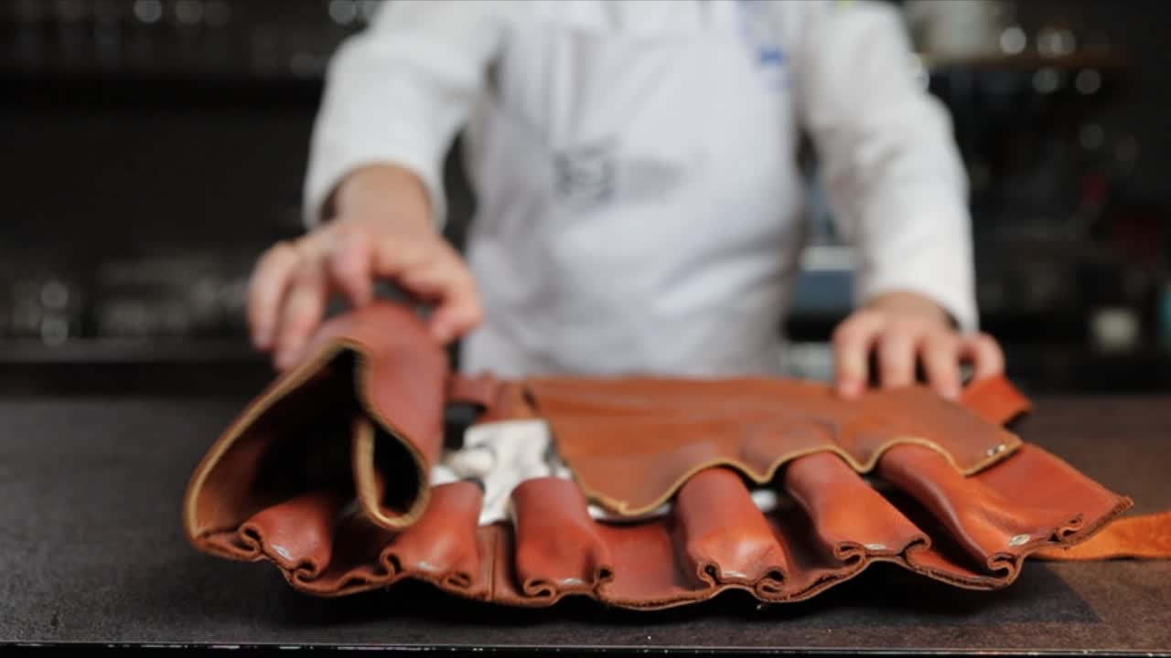 Chef Handling a Leather Knife Roll