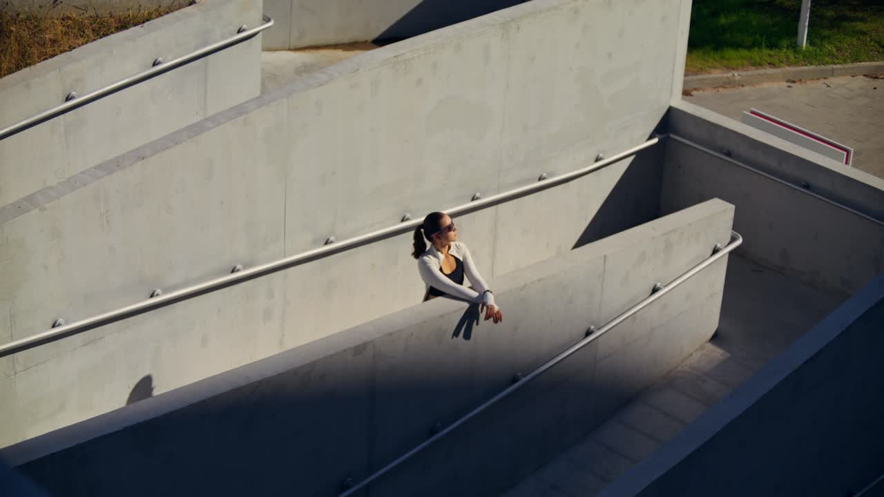 Woman in Urban Concrete Setting